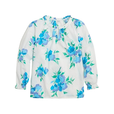 A white top with a blue-and-green floral print