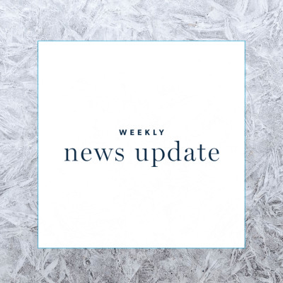 a white square with text "weekly news update," surrounded by a border of frost