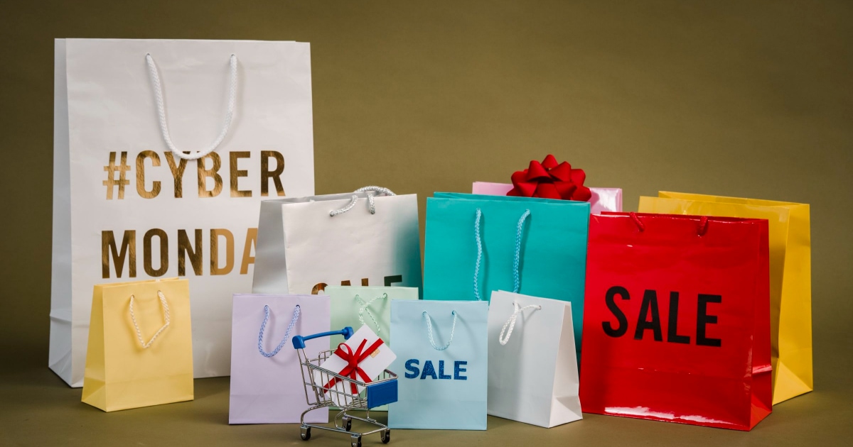 group of store bags read #CYBER Monday and SALE