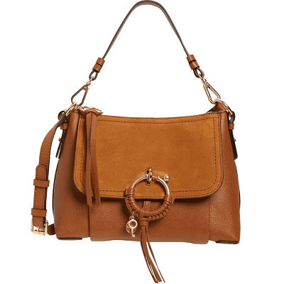 caramel brown suede and leather bag with a big circular ring and flap