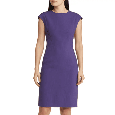 A woman wearing a purple dress