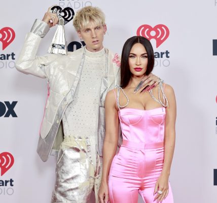 Machine Gun Kelly, winner of the Alternative Rock Album of the Year award for 'Tickets To My Downfall,â€™ and Megan Fox attend the 2021 iHeartRadio Music Awards at The Dolby Theatre in Los Angeles, California, which was broadcast live on FOX on May 27, 2021.