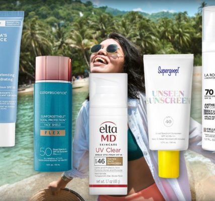 A Woman On The Beach Surrounded By Sunscreens