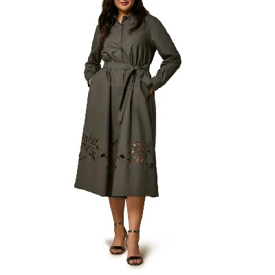 A woman wearing a army navy long sleeve dress and open sandal heels