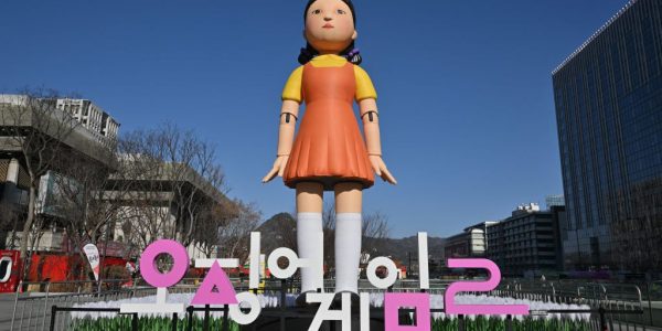 An inflatable Young-hee doll is displayed to promote Netflix's South Korean series "Squid Game Season 2" at Gwanghwamun Square in Seoul on December 26, 2026. (Photo by Jung Yeon-je / AFP) (Photo by JUNG YEON-JE/AFP via Getty Images)