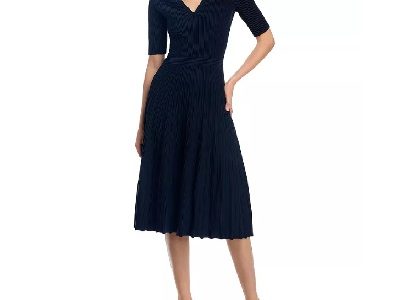 A woman wearing a dark navy blue collared dress with black sandals