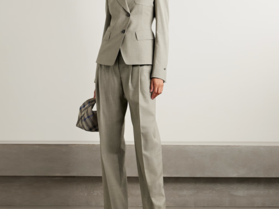 beigey gray suit with asymmetric button details on the blazer