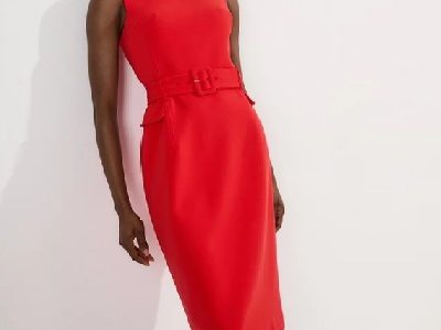 A woman wearing a bright red sleeveless midi dress