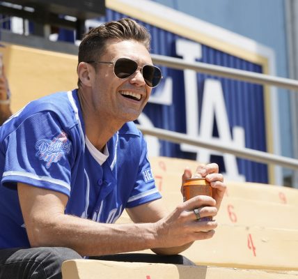 In this image released on June 26,  Ryan Seacrest partners with Health-Ade to bring kombucha to LA Dodger Fans at Dodger Stadium on May 17, 2023 in Los Angeles, California.