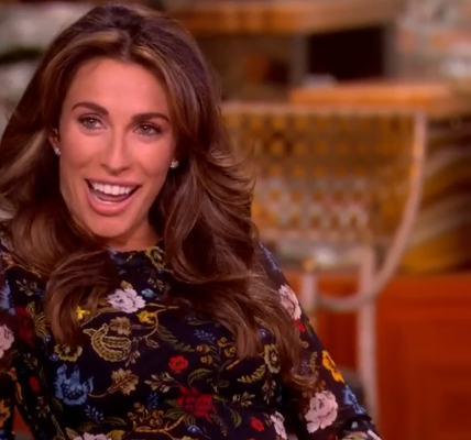 Alyssa Farah Griffin smiles and cups her baby bump on The View.