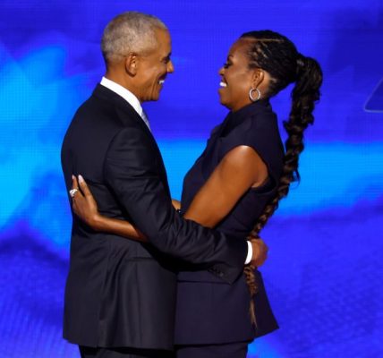 CHICAGO, ILLINOIS - AUGUST 20: Former U.S. President Barack Obama (L) greets former first lady Michelle Obama as he arrives to speak on stage during the second day of the Democratic National Convention at the United Center on August 20, 2024 in Chicago, Illinois. Delegates, politicians, and Democratic Party supporters are gathering in Chicago, as current Vice President Kamala Harris is named her party's presidential nominee. The DNC takes place from August 19-22. (Photo by Chip Somodevilla/Getty Images)