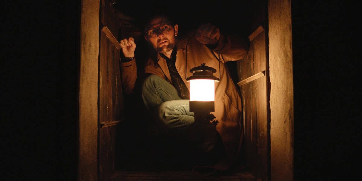 The horror film Hokum, starring Adam Scott, has secured a May 2026 release and unveiled the first image of Scott's character