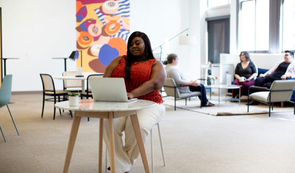 young black women sitting in office chair