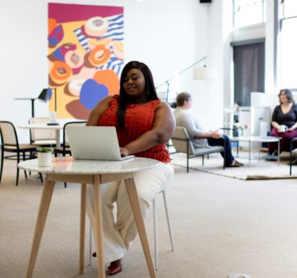 young black women sitting in office chair