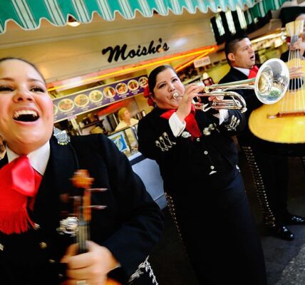 LOS ANGELES, CA - MAY 05:  Judith Merillo (L) Esmeralda Garcia (2nd-L) Guillermo Nunez (C) Mariana Nanez and Ileana Garcia (R)  members of the all-female strolling Mariachi band, Ellas Son, perform at Los Angeles Farmer Market during Cinco de Mayo festivities on May 5, 2011 in Los Angeles, California. Nunez was filling for the recovering injured female base player who was shot in the arm at a Mexican restaurant two weeks ago. Cinco de Mayo celebrates the 1862 Mexican victory over the French in the Battle of Puebla.  (Photo by Kevork Djansezian/Getty Images)