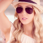 Hipster posing with straw hat