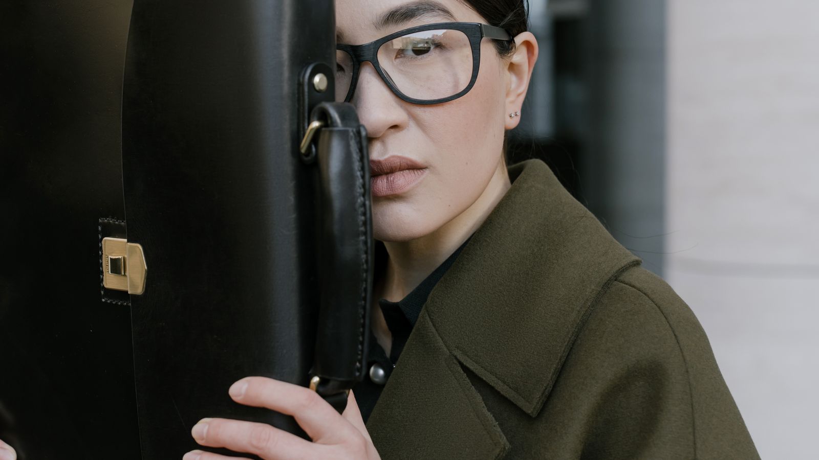 Lady with coat and briefcase