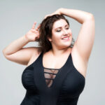 Sexy plus size fashion model in black one piece swimsuit