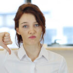 Woman giving thumb down