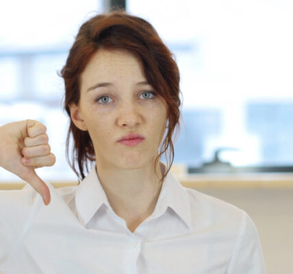 Woman giving thumb down
