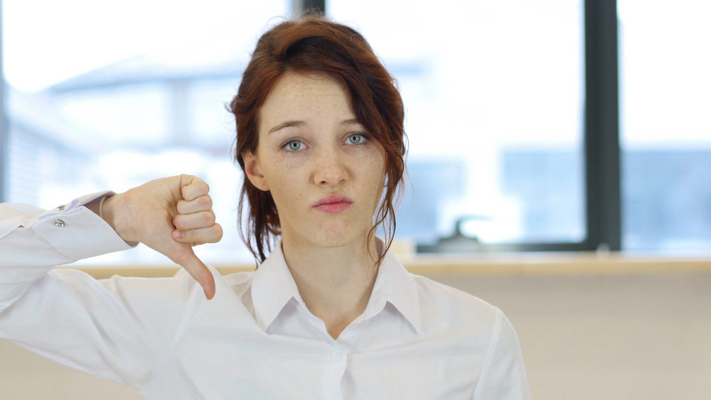 Woman giving thumb down