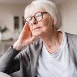 Sad tired lonely senior woman. Image credit Inside Creative House via Shutterstock