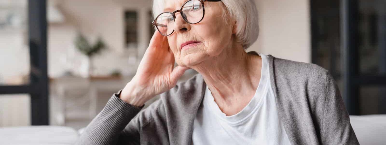 Sad tired lonely senior woman. Image credit Inside Creative House via Shutterstock