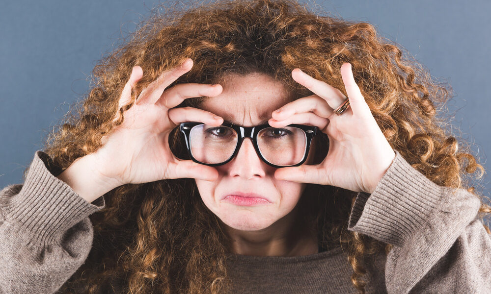 Nerd Woman on Gray Background