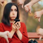 lady receiving thumbs down