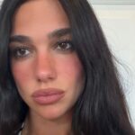 Dua Lipa Wears Plunging Corset Top Showcasing Her Curves