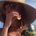 Topless Heidi Klum Enjoys Chips in Bikini Bottoms