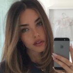 Madison Beer Wears Corseted Mini Dress While Squatting