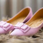Elegant pink leather flats with bow detail on furry background, perfect for a chic footwear collection.
