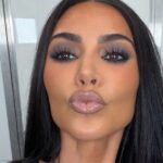 Backless Body-Hugging Dress by Kim Kardashian Held by Strings