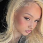 Alabama Barker Wears Daring Bare-All Dress That Captivates
