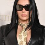 Charli XCX Pairs Tie with Bare Skin Under Plunging Blazer