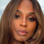 Plunging White Shirt: Ciara Showcases Her Legs in Style