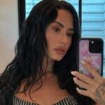 Demi Lovato Wears Deep-Cut Blazer Without a Bra