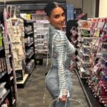 Plunging Dress by Kim Kardashian Holds with Thin Strings