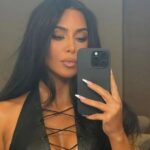 Voluptuous Curves of Kim Kardashian Shine in Low Cut Dress